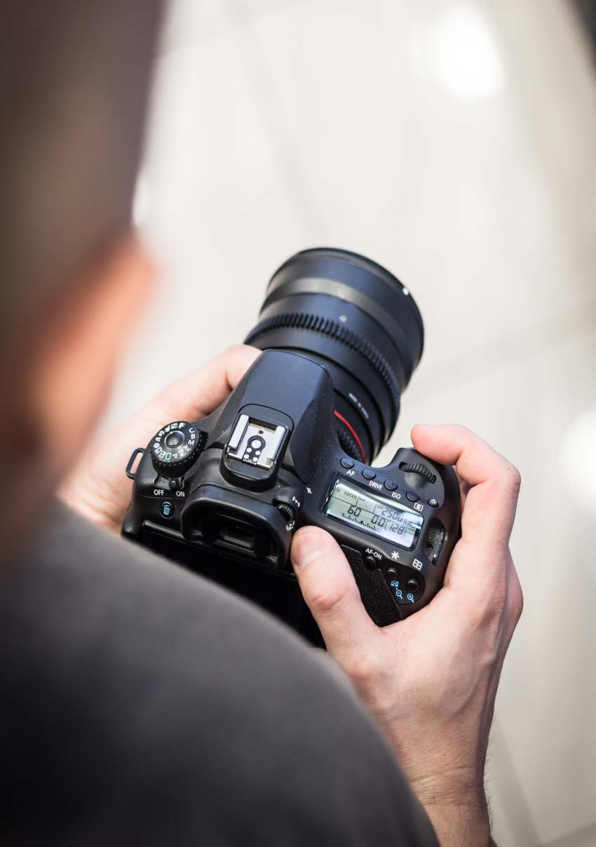 Photographer holding a professional photography camera