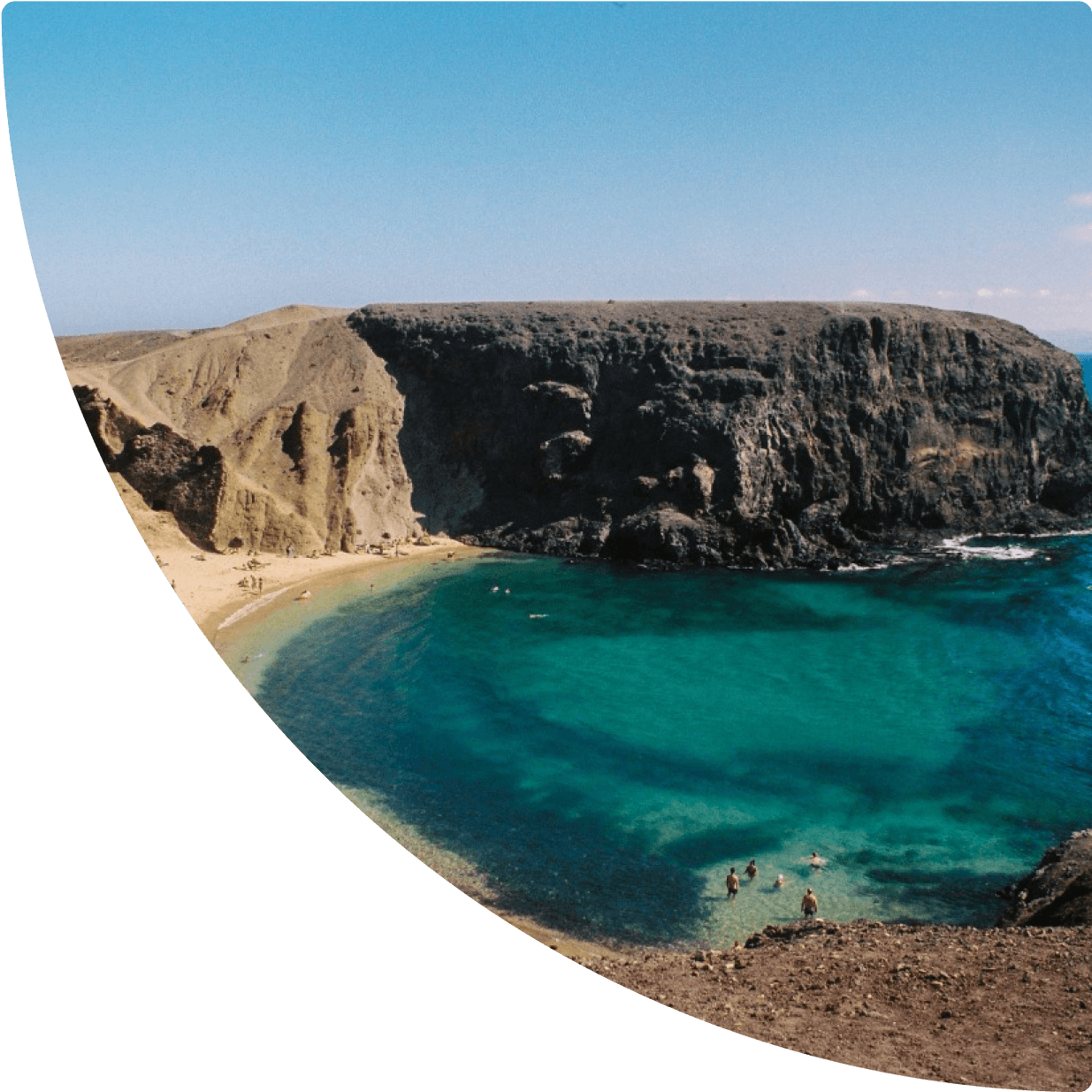 a rocky cliff and beach
