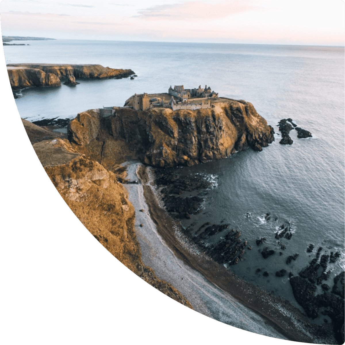 a building on a cliff above water