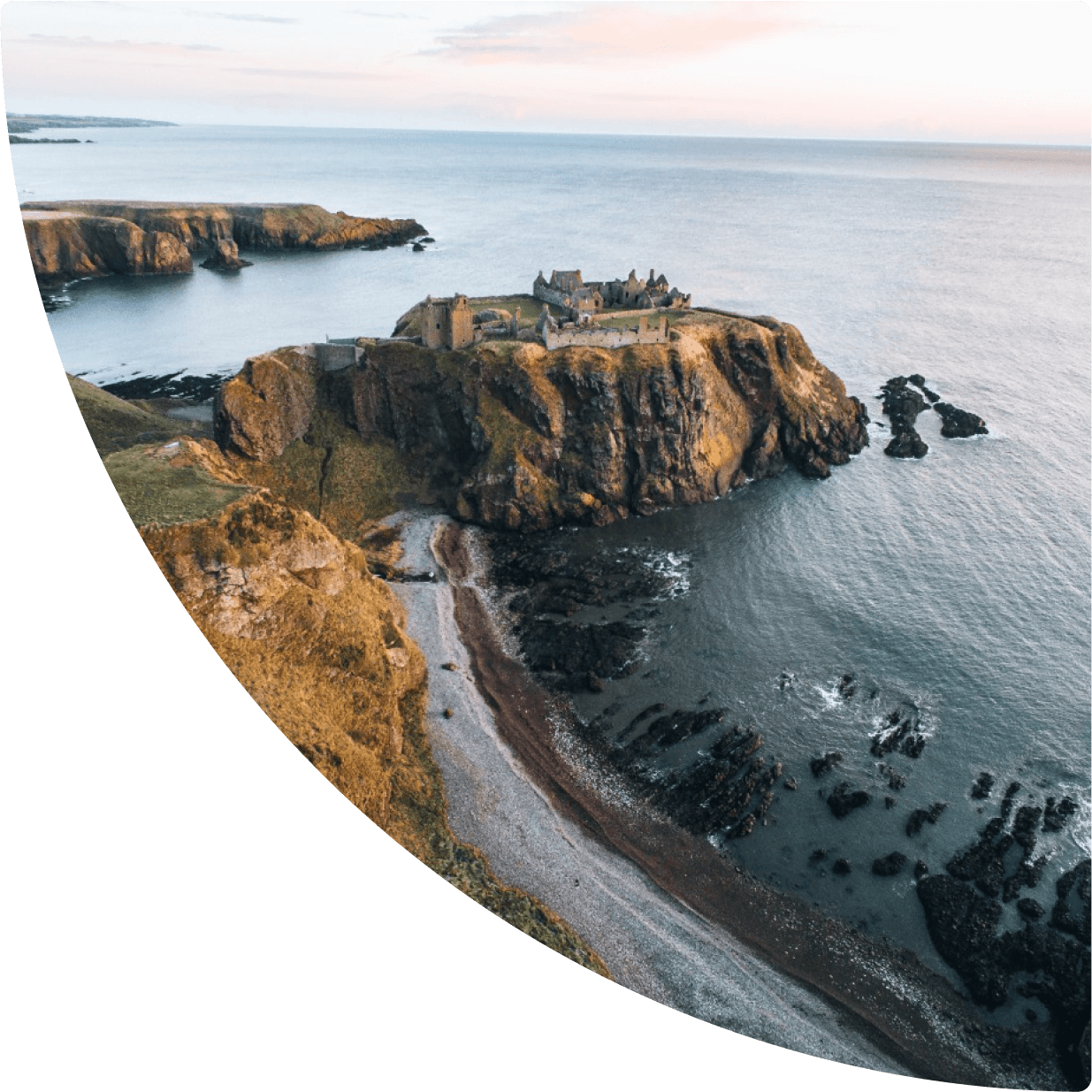 a building on a cliff above water