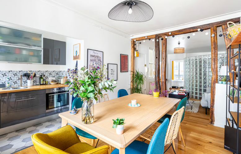 a dining table with chairs in a room