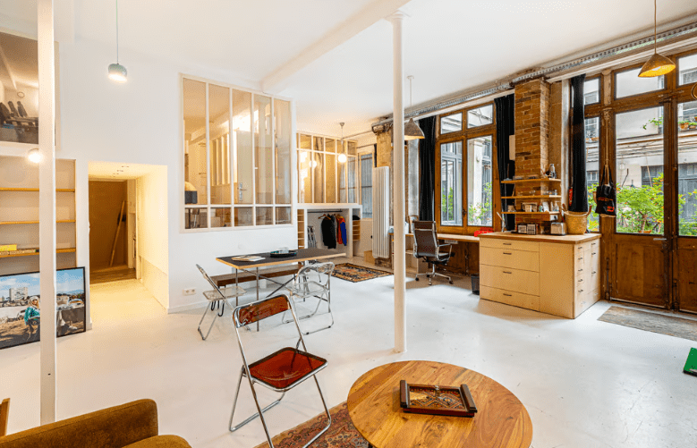 a room with a table and chairs