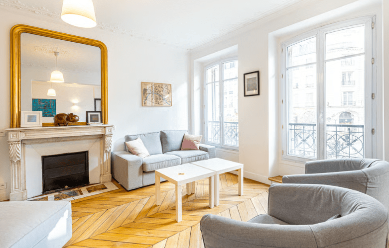 a living room with a fireplace and couches