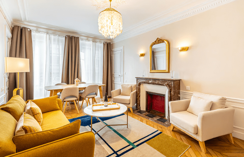 a living room with a fireplace and a table
