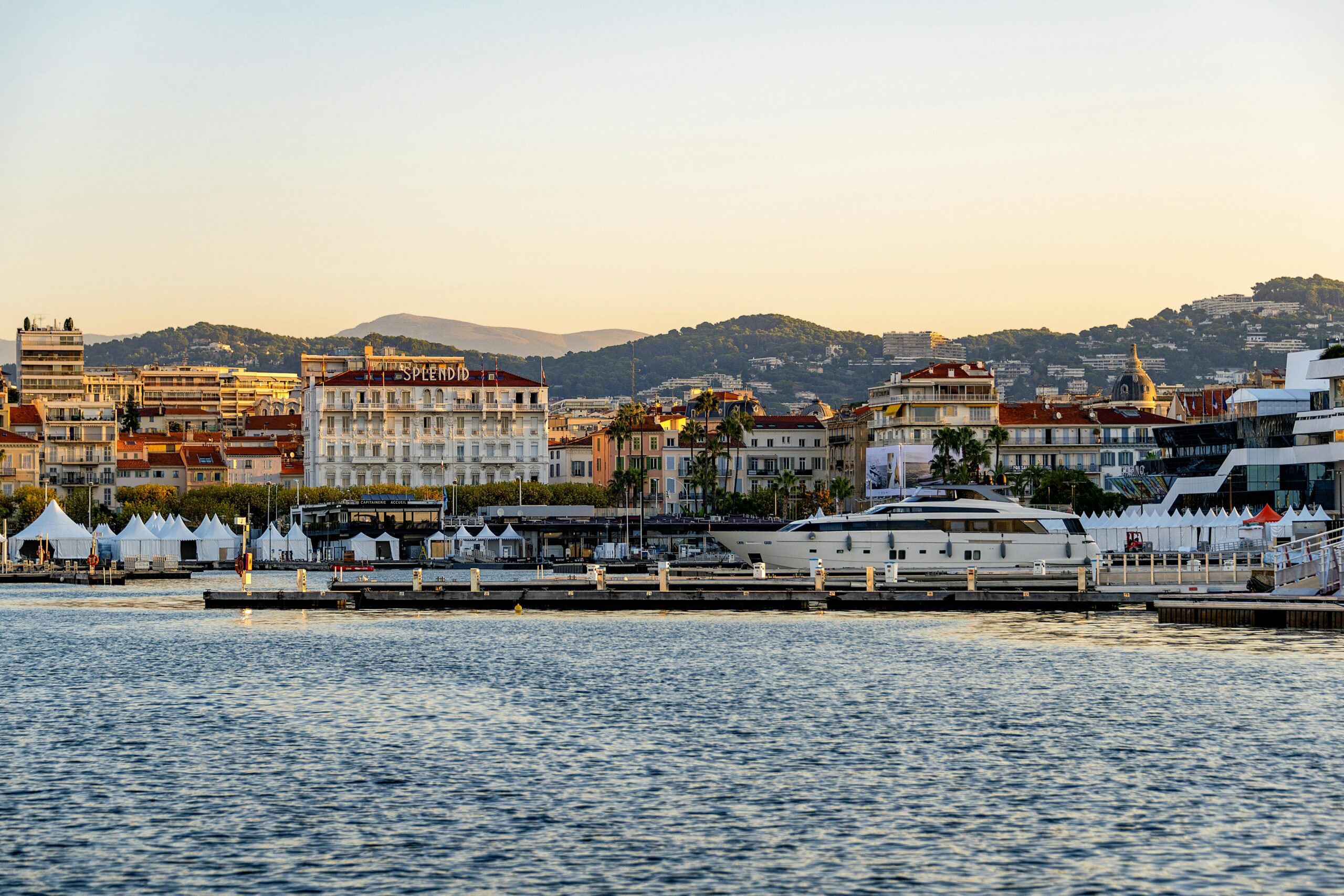 Seaside view of Cannes at sunset - where to go on holiday in august