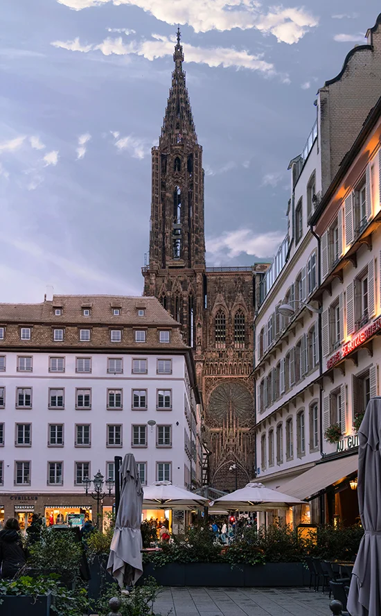 Strasbourg city center with cathedral tower and lively square — Airbnb management Strasbourg